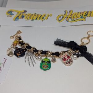 Sold****Gold Charm Bracelet with Colorful Skulls